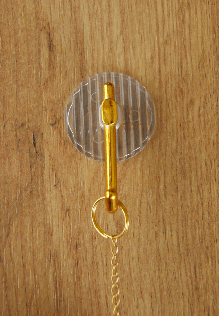 Crochet autocollant doré